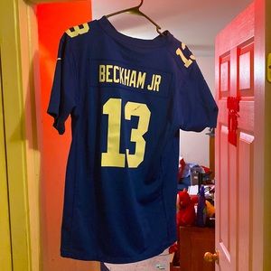 it says XL fits like a medium worn twice, has a small black mark on the 3 number